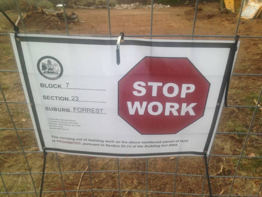 The stop work notice on the Forrest property, with the cleared section of the block in the background. Photo: Matthew Raggatt