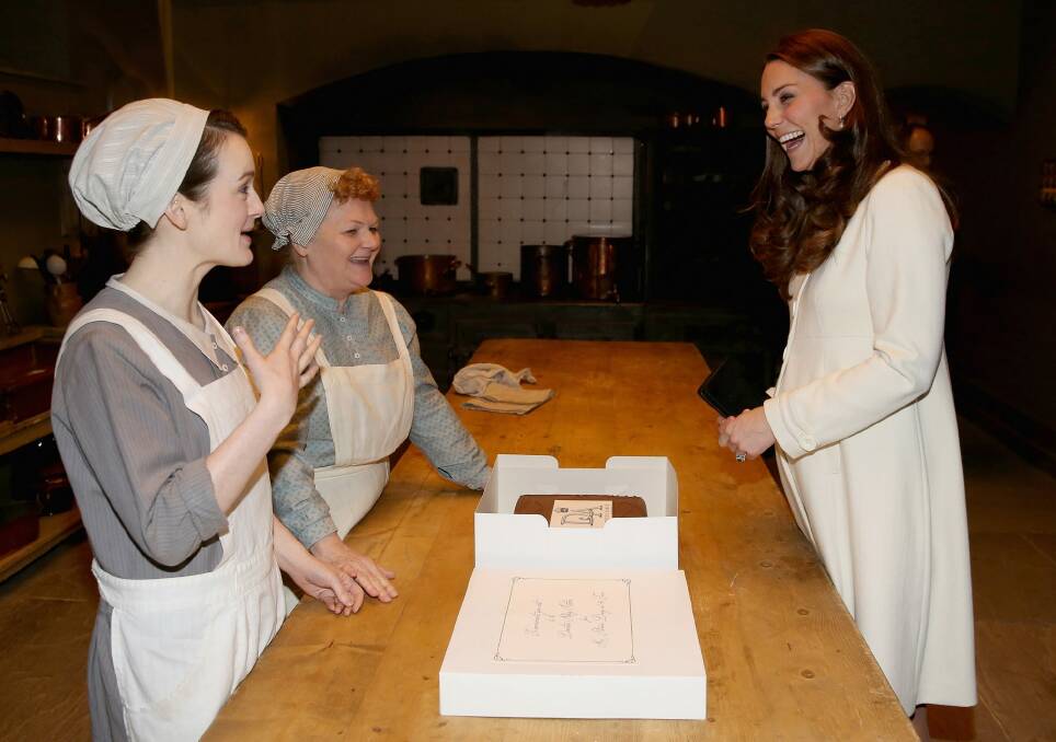 Lady of the House: Catherine, Duchess of Cambridge chats to actresses Sopie McShera and Lesley Nicol during a visit to the set of Downton Abbey. Photo: Getty Images