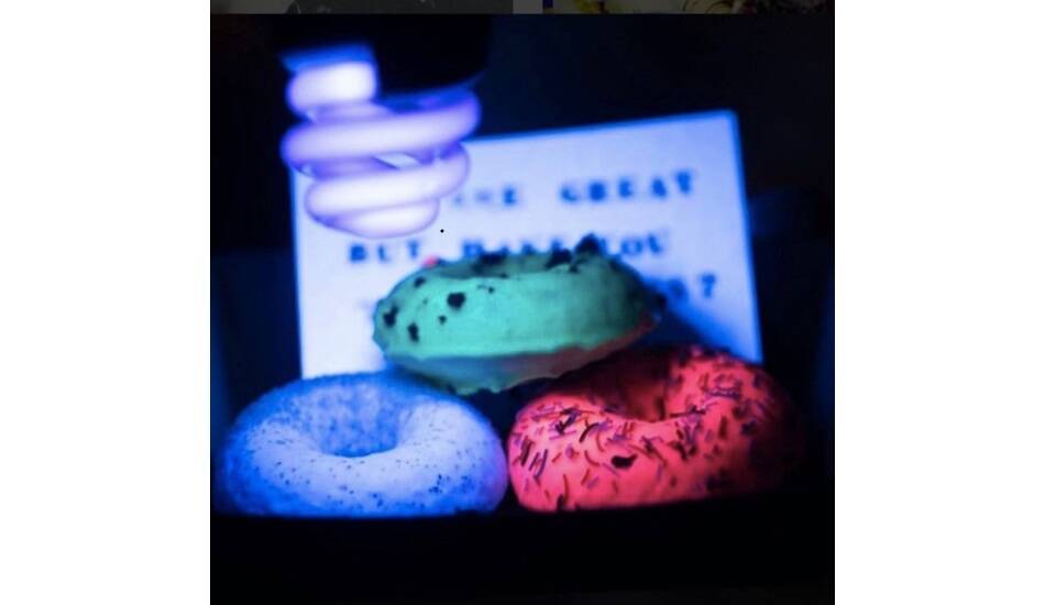 Glownuts - glow in the dark doughnuts - are coming to Enlighten, complete with blue light selfie box. Photo: supplied