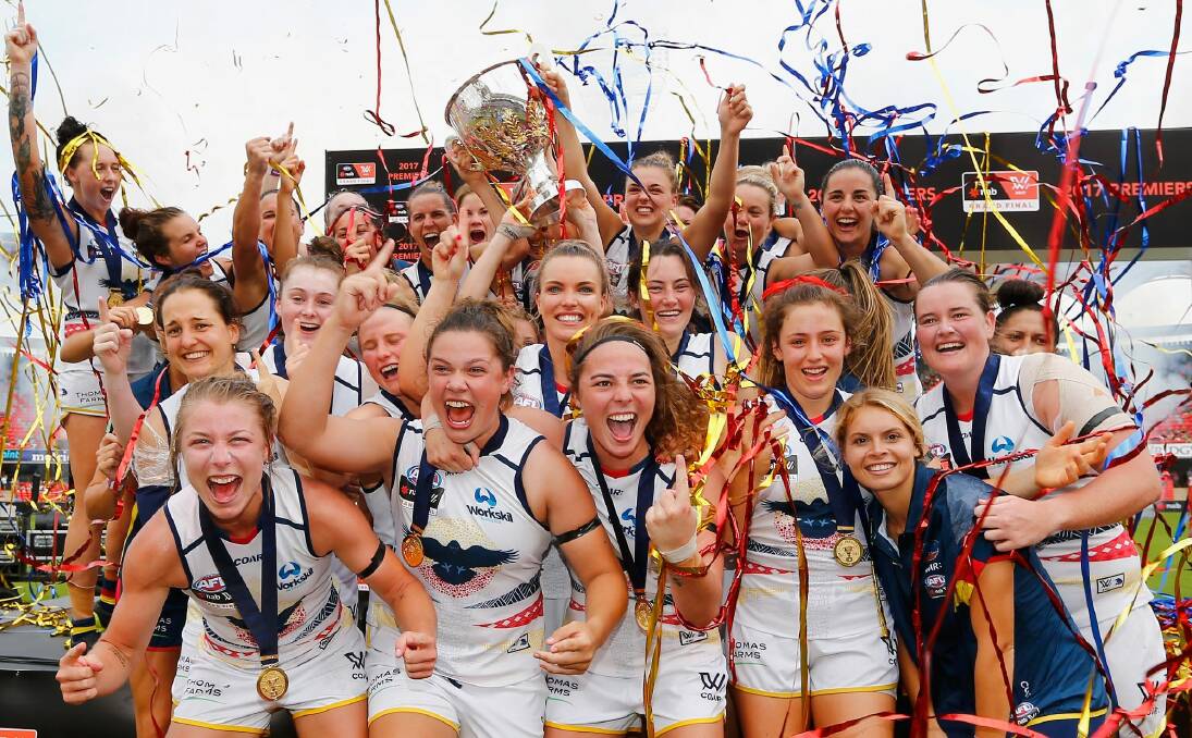 Crows players celebrate their AFL Women's grand final success. Photo: Getty Images