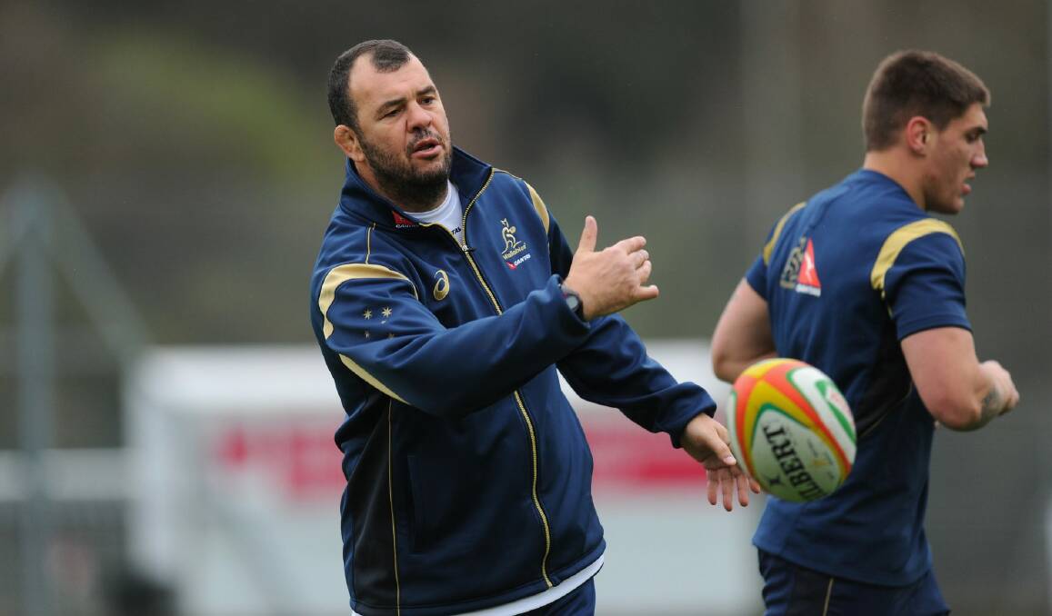 Hands on: Michael Cheika with Sean McMahon at Wallabies training. Photo: Getty Images