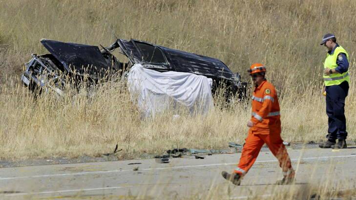 Emergency workers at the scene of the accident near Holbrook on Boxing Day. Photo: David Thorpe