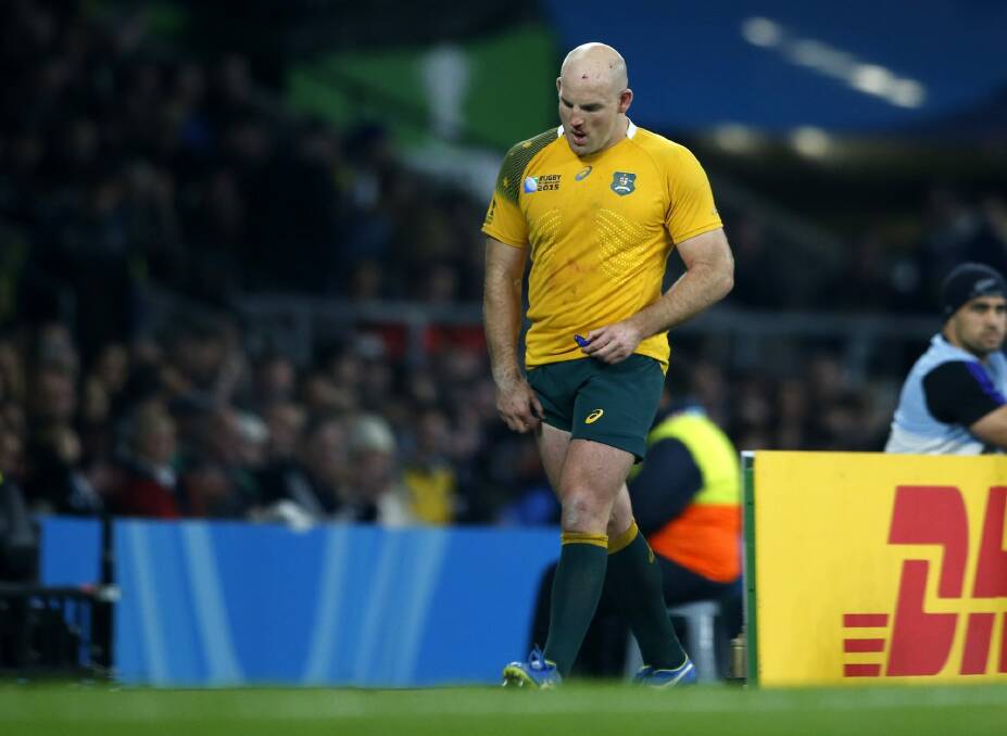 Australia's Stephen Moore leaves the field during the Rugby World Cup final between New Zealand and Australia at Twickenham Stadium, London, on Sunday. Photo: Alastair Grant
