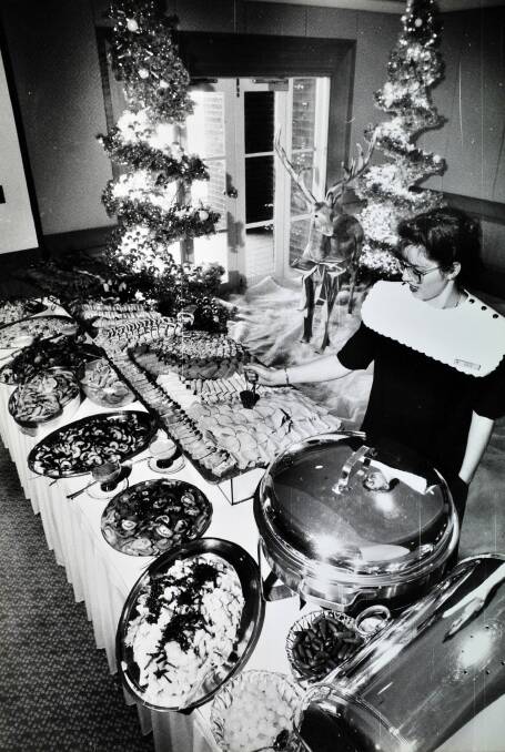 Flashback:  Waitress Julie Blunt puts the finishing touches to the cold meat selection of a Hyatt Hotel banquet table.