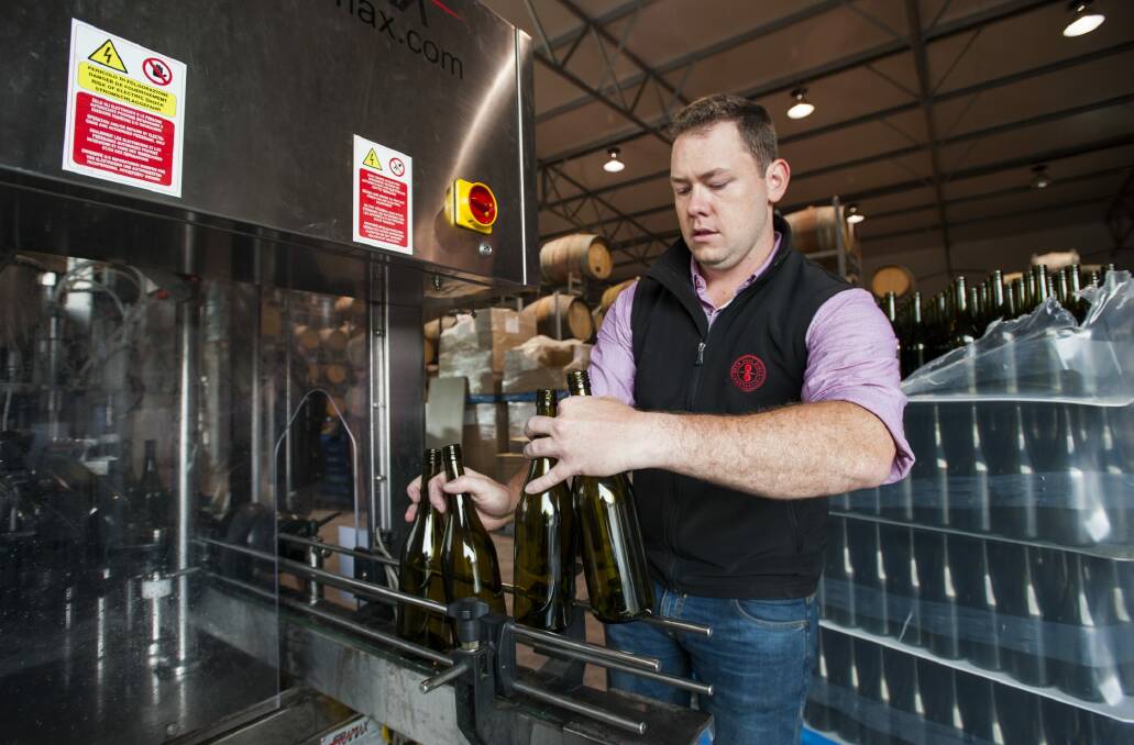 Eden Road Wines assistant wine maker Mike Lloyd bottles the 4 Tonne Project Wines. Photo: Elesa Kurtz
