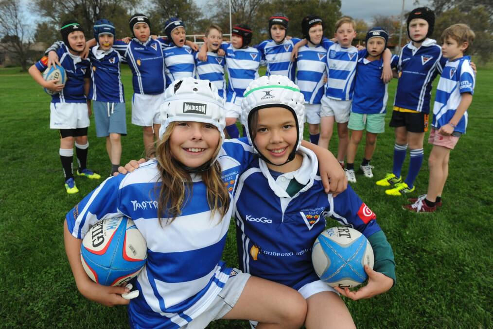 The Royals under-10 rugby union team training at Rivett Oval two years ago with girls Dusty-Rose Bates, left, and Lizzy Marshall. Photo: Graham Tidy