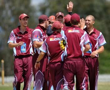 Tuggeranong's Michael Wescombe was caught near the boundary off the bowling of Dale Riley, pictured being congratulated at right. Photo: Graham Tidy