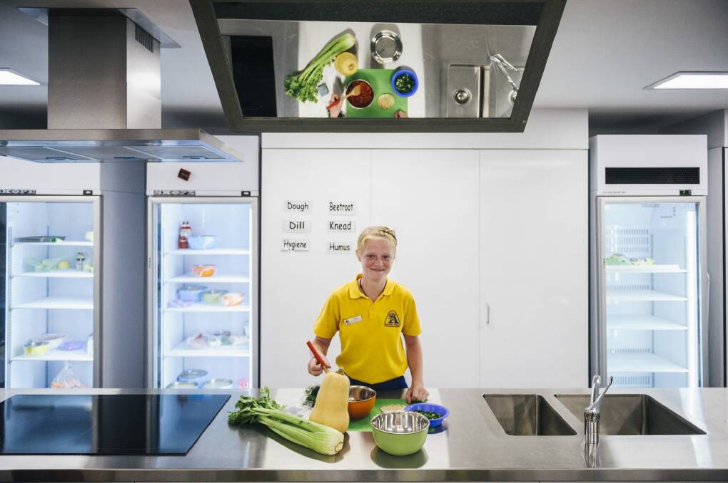 Lily Bray in the new kitchen at Arawang Primary School  in Waramanga. Photo: Rohan Thomson