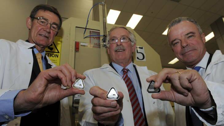 Air Chief Marshall Angus Houston (Ret'd), Ross MacDiarmid, Mint CEO and Dr. Brendan Nelson, AWM Director with examples of the coin. Photo: Graham Tidy