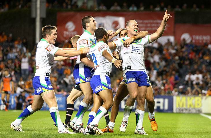 Terry Campese of the Raiders celebrates his try with teammates during the round four NRL match against the Wests Tigers. Photo: Getty Images
