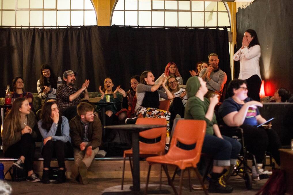 The poets are judged by audience members. Photo: Adam Thomas