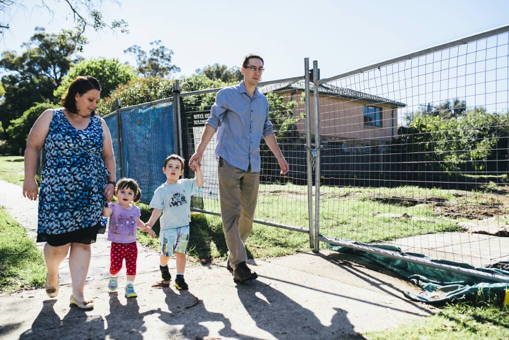 The Pilkington family, Christina, Isabelle, 2, Theodore, 3, and Chris outside their Ainslie Fluffy block. Photo: Rohan Thomson
