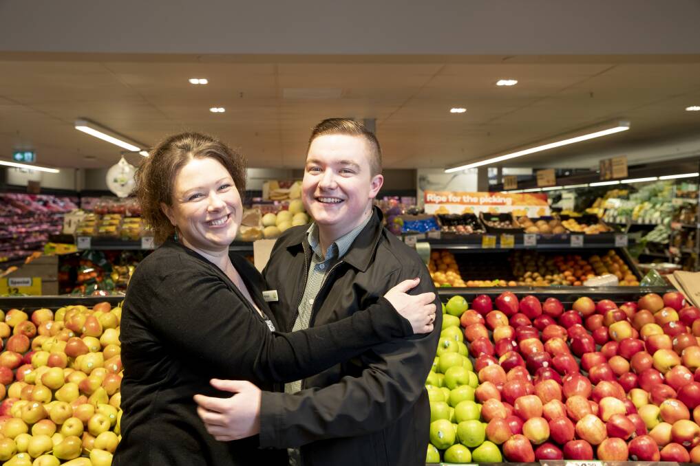 Hamish Flanagan at Woolworths in Charnwood meeting mum-in-need Fiona Crispin after his random act of kindness. Photo: Sitthixay Ditthavong