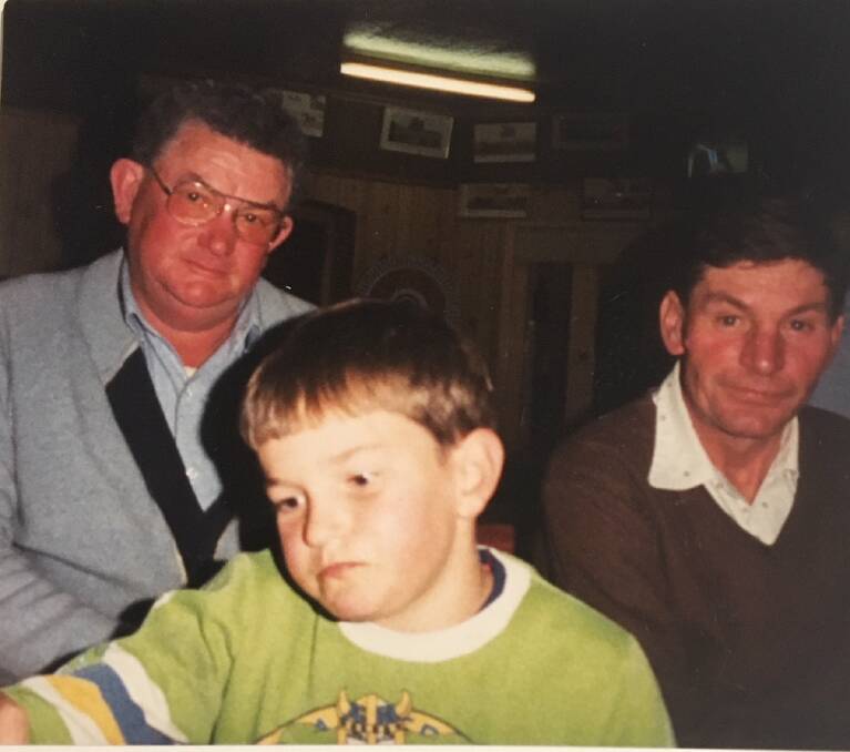Michael, centre, as a young boy with his dad Lionel, left, and uncle Lenny, right.  Photo: Supplied