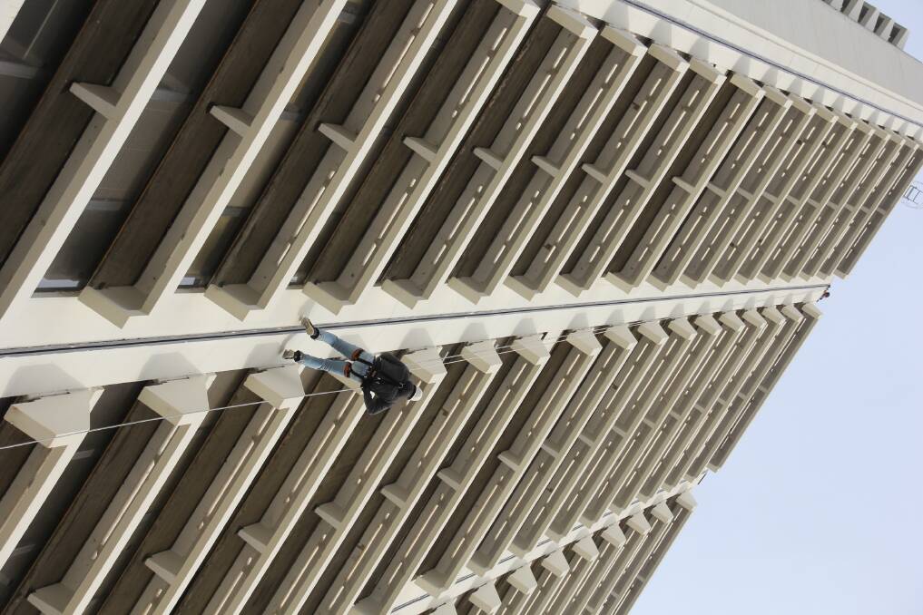 An abseiler tests out the 90 metre Lovett Tower descent. Photo: Cheryl O'Donnell