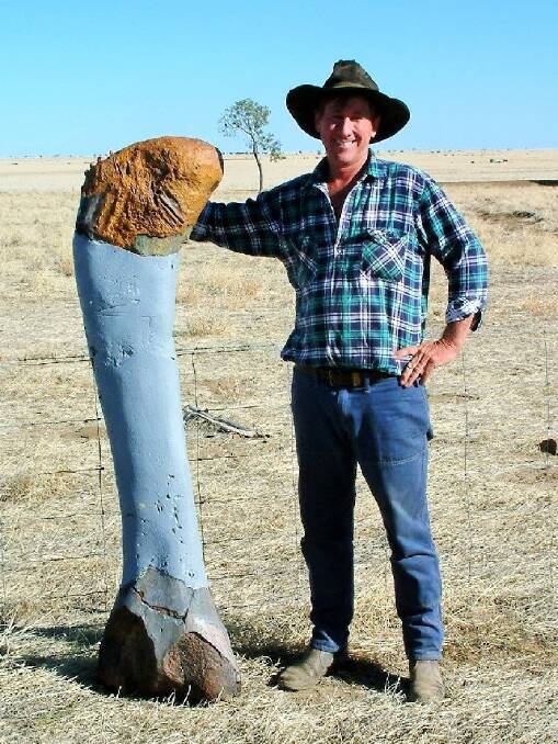 Farmer David Elliot with a replica of the dino bone he found on his property while mustering sheep. Photo: Supplied