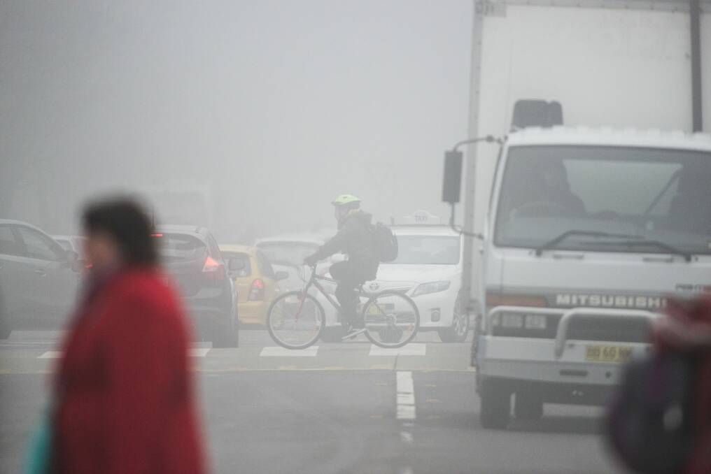 Thick fog in Canberra on Friday made road travel difficult. Photo: Rohan Thomson