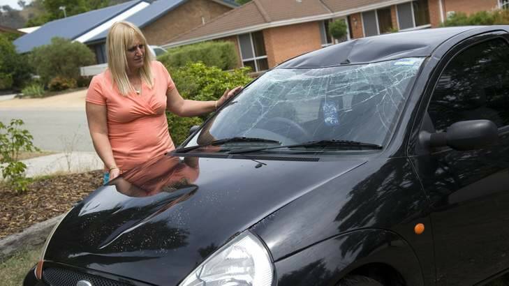 Leanne Burrows, with her first car that was damaged by vandals in January. Photo: Elesa Lee