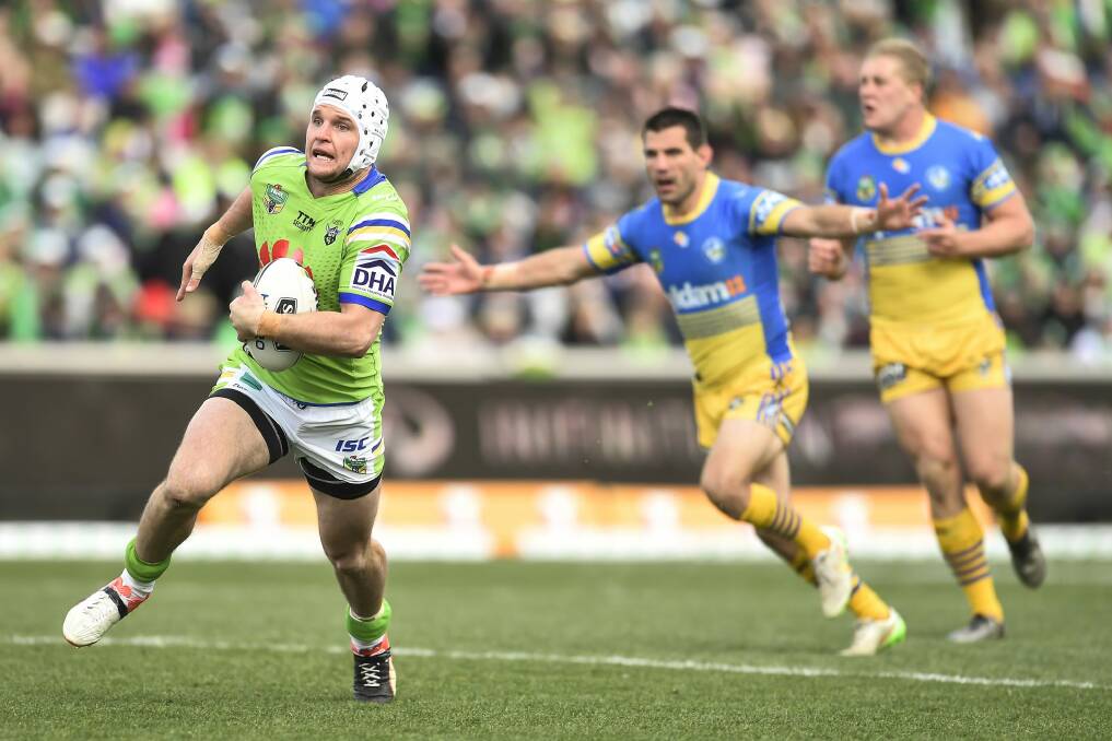 Leading man: Raiders skipper Jarrod Croker makes a break on his way to the try line. Photo: Getty Images