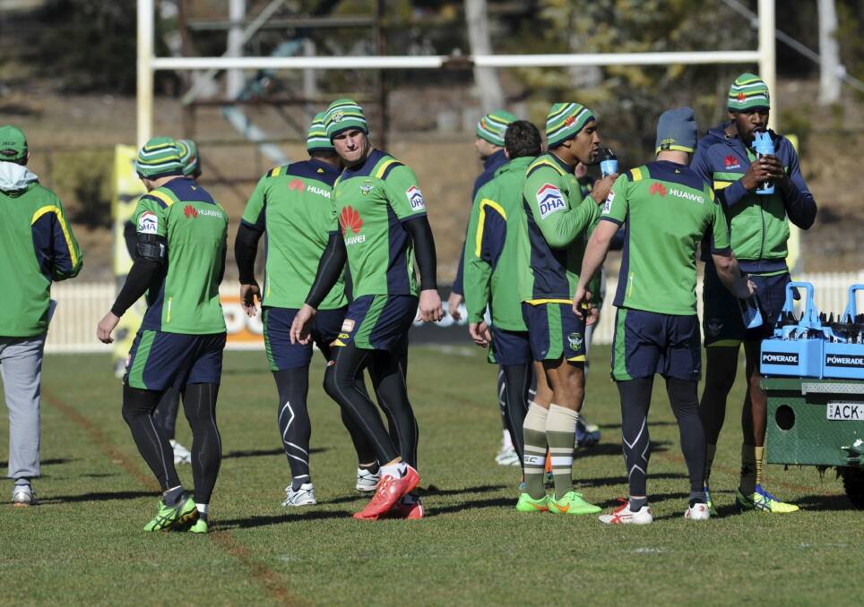 Heating up: Raiders players trained in beanies and compression clothing on Wednesday to get used to the Townsville climate. Photo: Graham Tidy