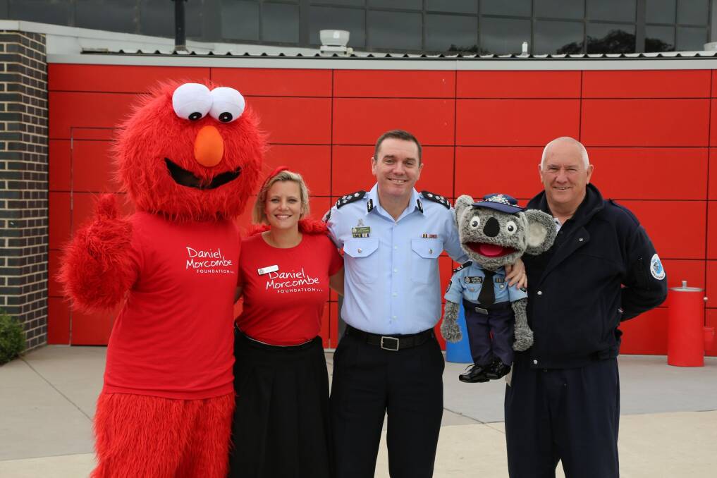 Elmo, AFP's cyber and child safety team leader Rosie Garland, acting Assistant Commissioner Chris Sheehan, Constable Kenny and Stewart Waters during A Day For Daniel at Mother Teresa Primary School in Harrison. Photo: Supplied