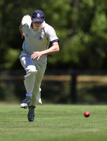 Jackson Long chases after a ball bound for the boundary. Photo: Jeffrey Chan