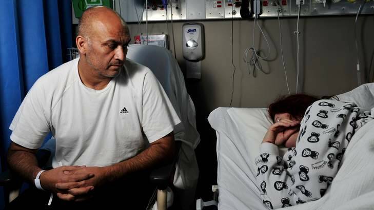 Salmonella victims Marcelo Solar sits with his wife in Calvary Hospital. Photo: Jay Cronan