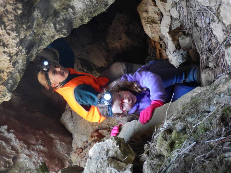 Tim’s two daughters emerge from a cavern on the ‘Little Caves for Little Kids’ tour at Yarrangobilly Caves. Photo: Tim the Yowie Man