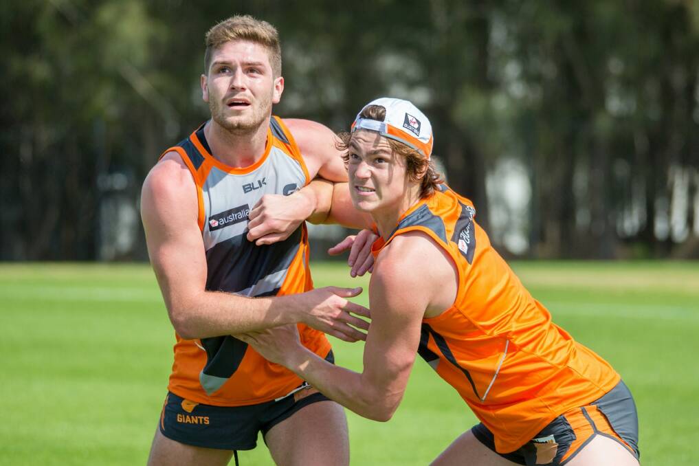 Tomas Bugg (left) wrestles with Canberra product Jack Steele at Giants training  Photo: Supplied 