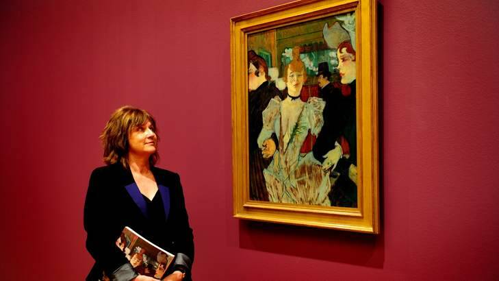 National Gallery senior curator Jane Kinsman looks at one of the paintings in the Toulouse Lautrec exhibition. Photo: Melissa Adams