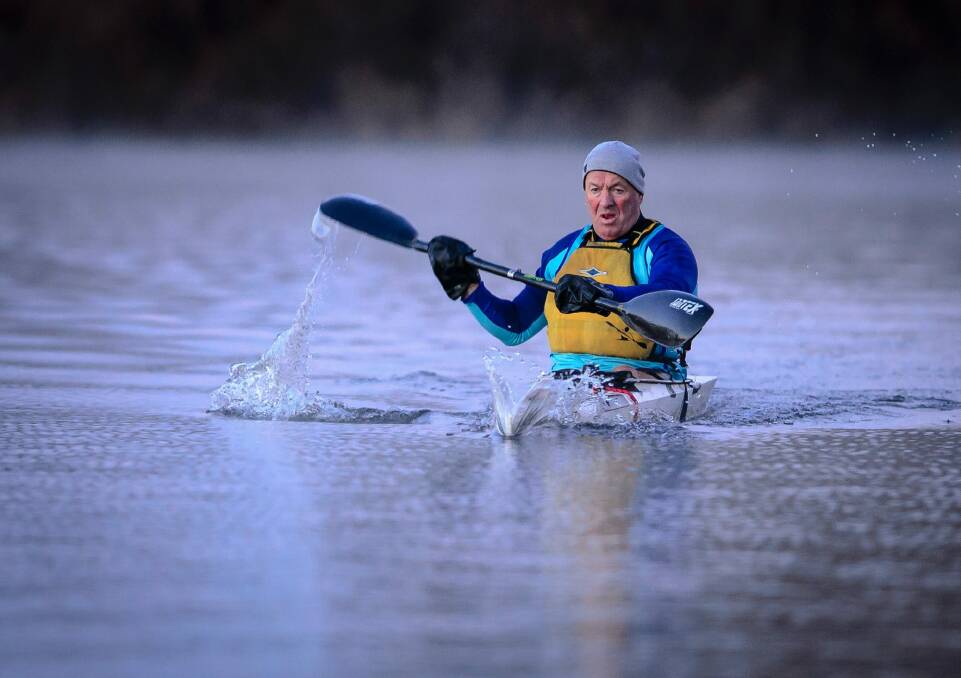 Kayaker John Preston from the Burley Griffin Canoe Club braves the start of winter. Photo: Sitthixay Ditthavong