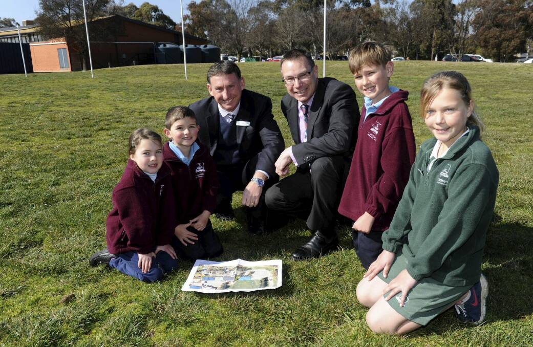 At the site for the new centre are, from left, Erin Kemp 6, Tyler Mullan 5, St Anthony's principal Greg Walker, Tim Smith from the Catholic Education Office, Ike Goddard, 11 and Abi McIntyre, 11. Photo: Graham Tidy