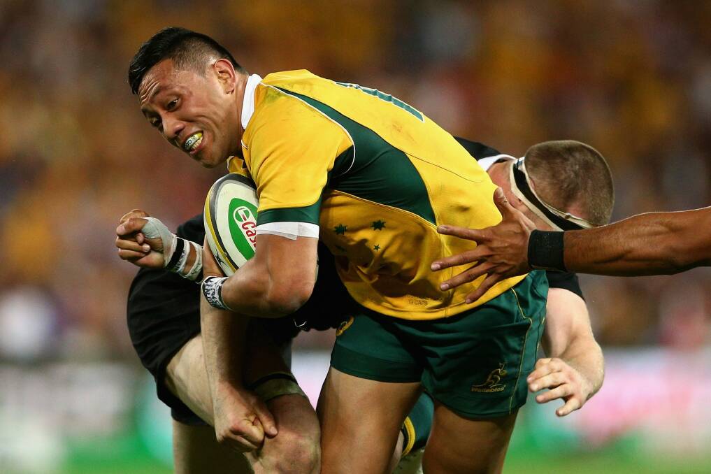 Wallaby force: Christian Leali'ifano is tackled during the Bledisloe Cup match against the All Blacks at Suncorp Stadium. Photo: Getty Images