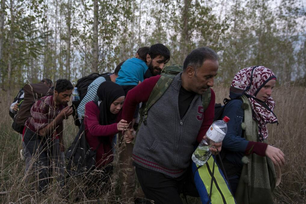 Refugees are moving on foot, in buses, trains and cars to find a safe haven. Photo: Dan Kitwood