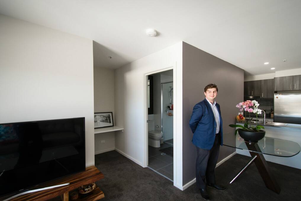 James Lara in his 57-square-metre apartment in Greenway. Photo: Sitthixay Ditthavong