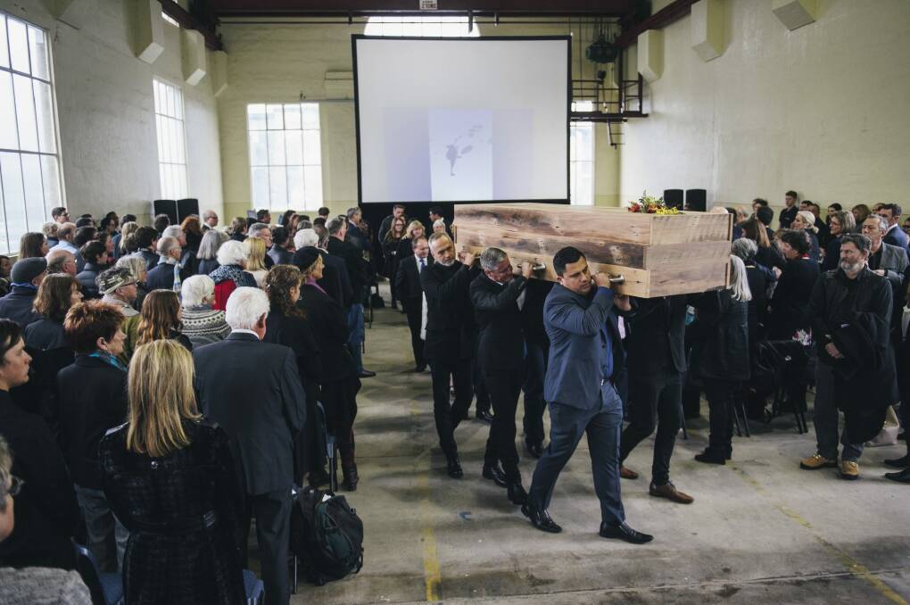 Pallbearers carry the bespoke coffin of designer Robert Foster at his funeral at the Fitters Workshop. 


 Photo: Rohan Thomson