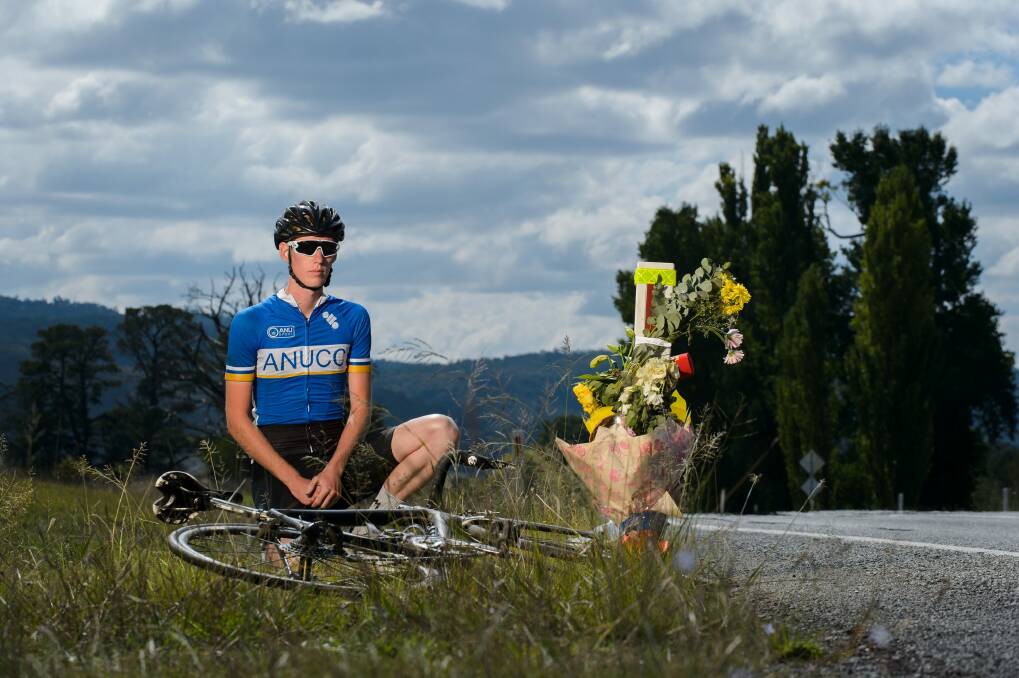 Canberra cyclist Lewis Brocklehurst visits the site of the accident that claimed the life of his idol, British endurance cyclist Mike Hall, on Friday.  Photo: Sitthixay Ditthavong