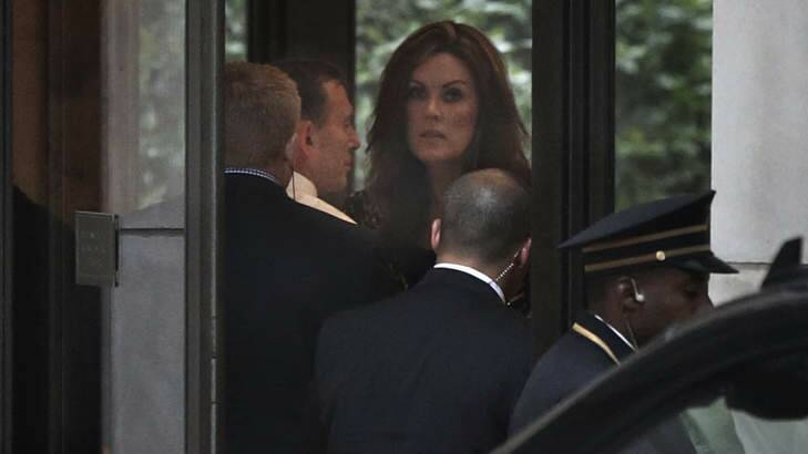 Prime Minister Tony Abbott and his chief-of-staff Peta Credlin arrive in the lobby of Rupert Murdoch's Central Park apartment in New York for dinner with the media mogul. Photo: Andrew Meares