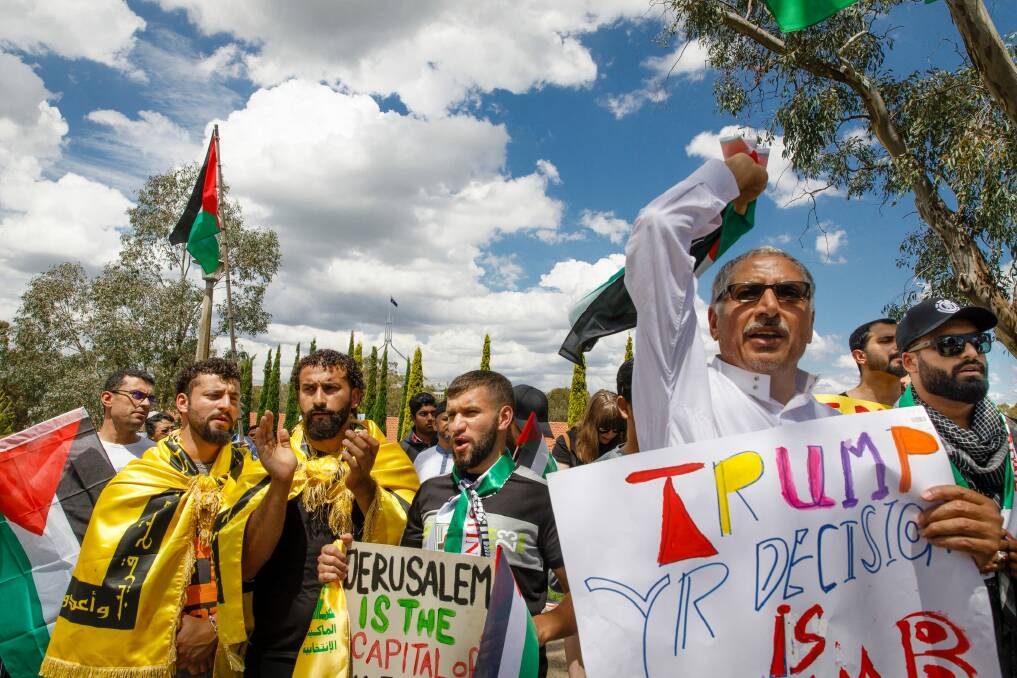 Community members from mixed faiths rally in front of the US embassy in Canberra to protest US President Donald Trump's decision to move the US embassy from Tel Aviv to Jerusalem. Photo: Sitthixay Ditthavong Photo: Sitthixay Ditthavong