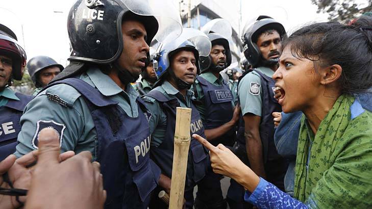 Angry populace: An activist argues with police in Bangladesh's capital, Dhaka, last week. Photo: Reuters