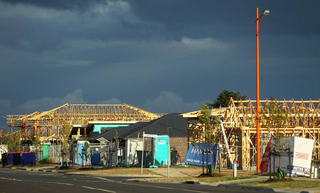 The Reserve Bank has warned construction activity could begin to decline as the number of residential building approvals falls from its peak in 2016.   Photo: Pat Scala