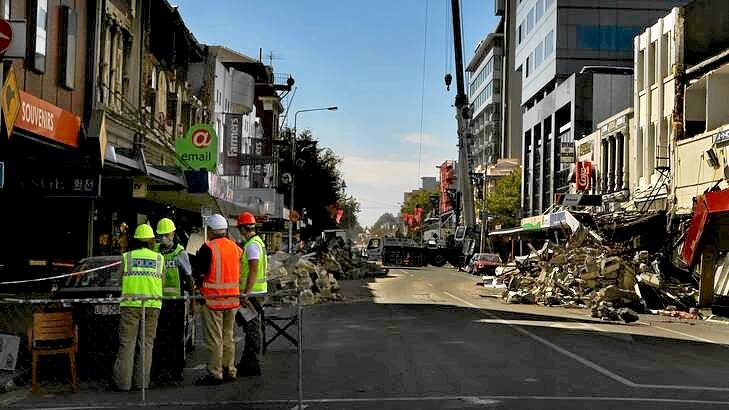 New Zealand police help clear debris from the city centre following the Christchurch earthquake in February last year. Photo: Kate Geraghty KLG