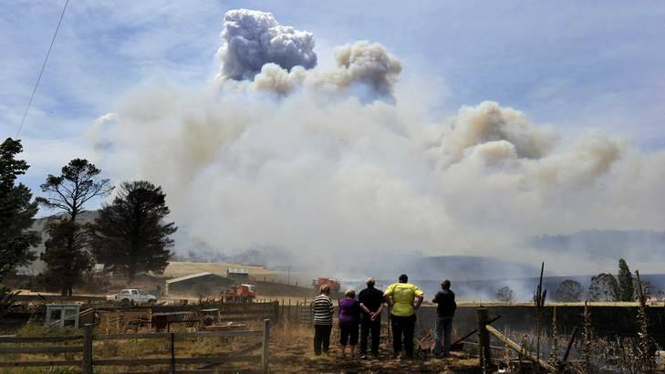Residents and the RFS on sight at the major bushfire on Mount Forest Road near Cooma, on Tuesday January 8. Photo: Jay Cronan