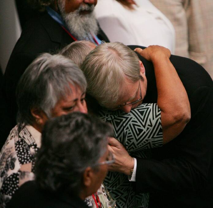 Kevin Rudd hugs guests after his apology to Indigenous Australians. Photo: Gary Ramage