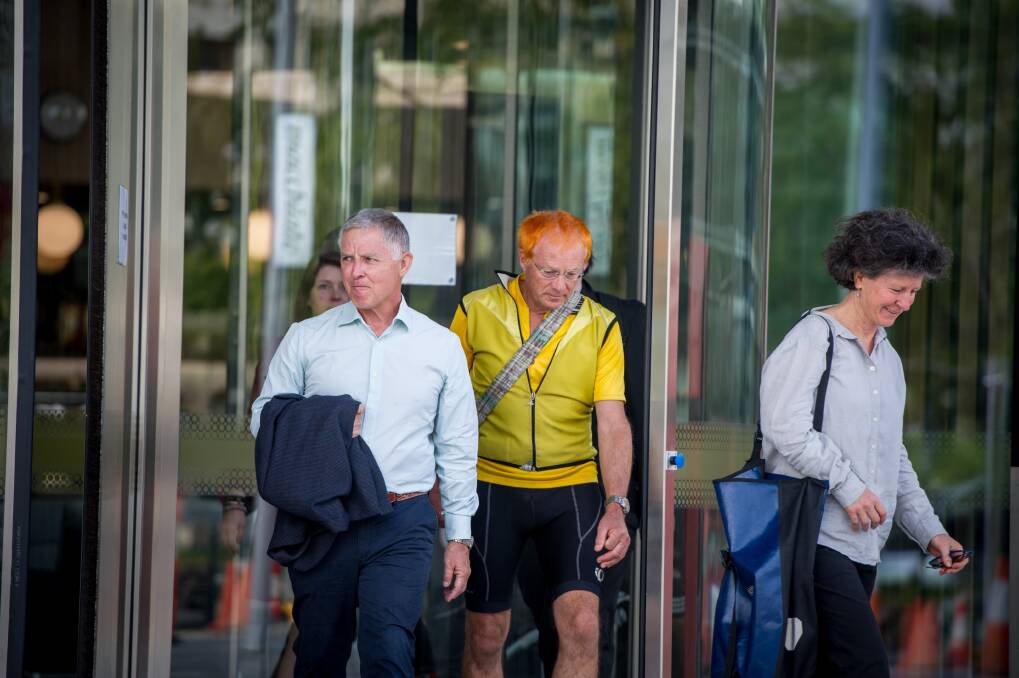 Pedal power members and supporters of Mike Hall leave the ACT courts after the inquest into Mr Hall's death was finalised. Photo: Karleen Minney