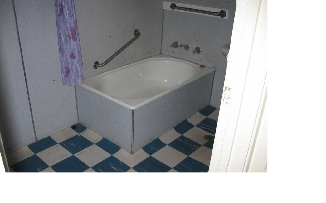 An ageing bathroom in public housing in Northbourne Avenue. Photo: Supplied ACT Government