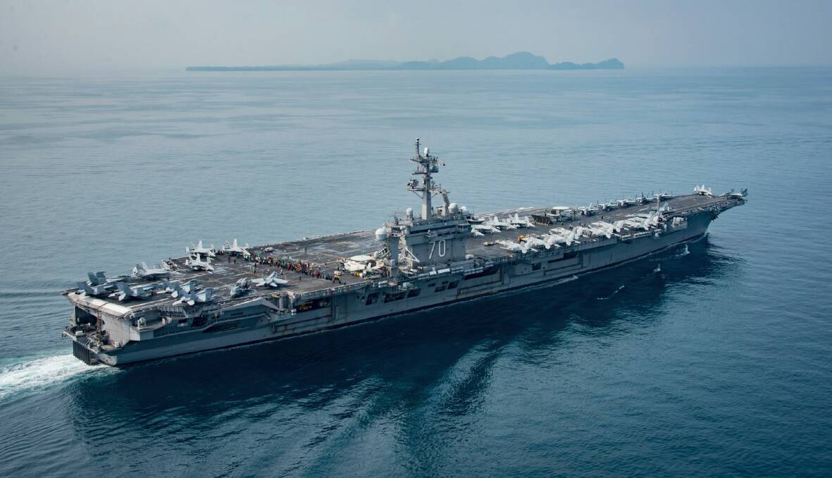 In this Saturday, April 15, 2017 photo released by the U.S. Navy, the aircraft carrier USS Carl Vinson transits the Sunda Strait between the Indonesian islands of Java and Sumatra. Photo: US Navy via AP