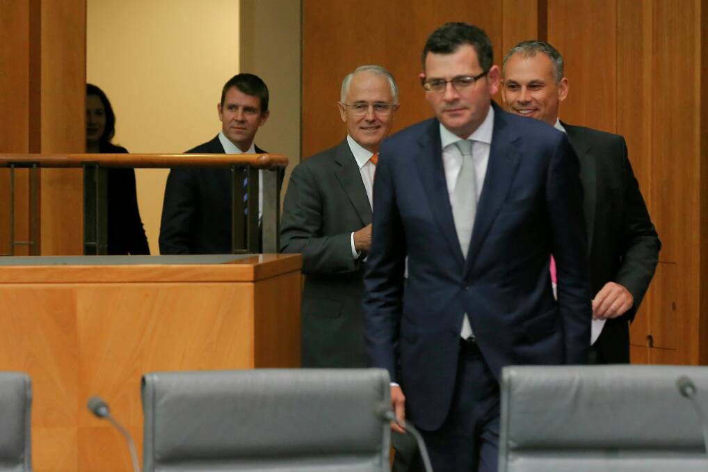 Daniel Andrews emerges to face the press alongside other state and federal leaders. Photo: Alex Ellinghausen