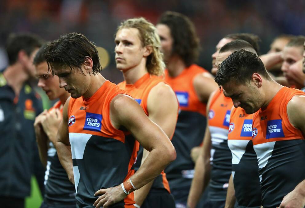 Dog of a day: Ryan Griffen (left) and the Giants come to terms with their preliminary final loss to the Western Bulldogs. Photo: Getty Images