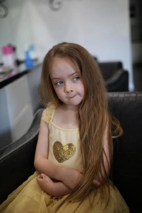 Kayley Bencke, 7, had her hair cut off for charity. Photo: Supplied